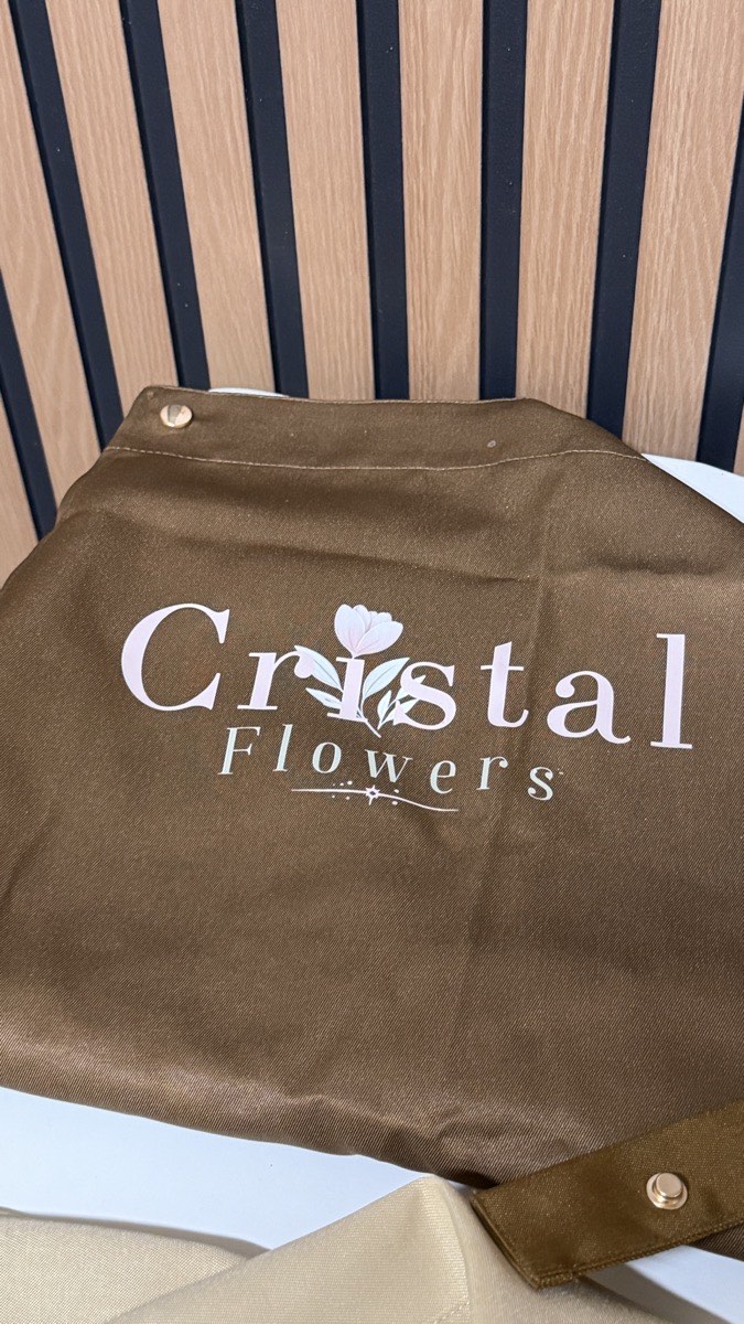 Cocoa Cristal Flowers branded apron