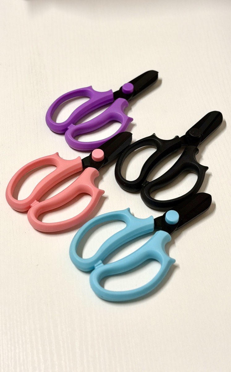 Professional floral shears in pink, black, purple and blue